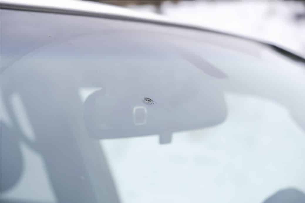 Windshield Chip Repair 30 part of slider image showing a chip removed on a USA windshield by TintBusiness